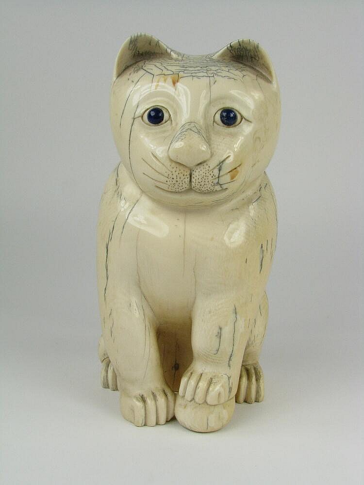 This ivory figure of a bemused cat sold for $10,782 against an estimate of $500-800.